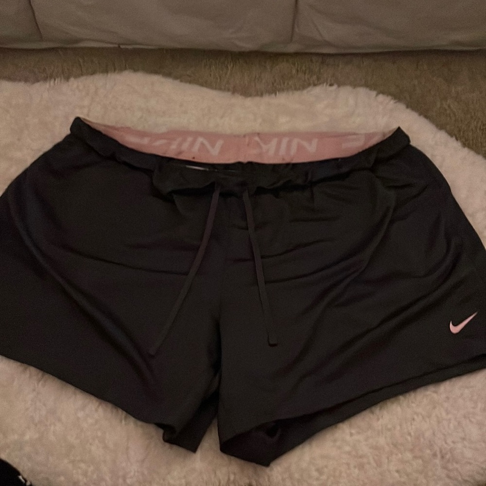 dark purple and pink nike athletic shorts